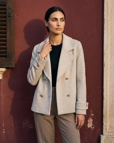 The Georgia Wool Coat in beige — double-breasted coat, front view on model