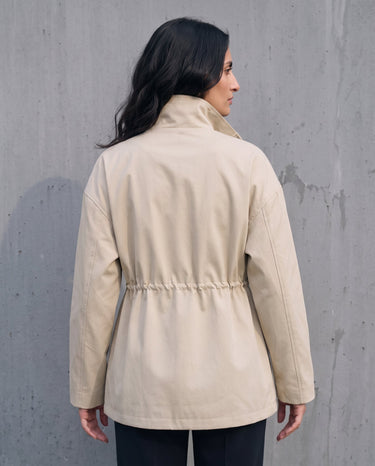 Back view of the light khaki Halden Coat showing the drawstring waist channel