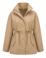 The Halden Coat in khaki, flat lay front view of the hooded utility jacket with drawstring waist
