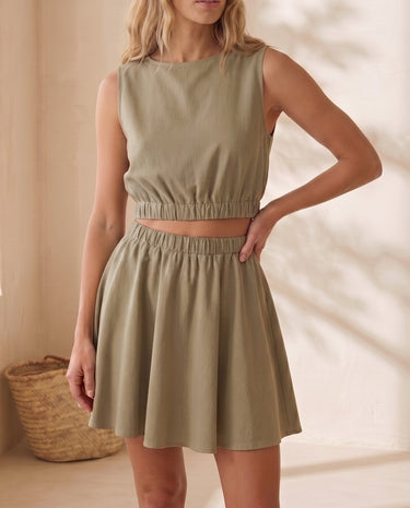 The Isola Cotton & Linen Skirt Set in khaki — crop top and mini skirt set, front view on model