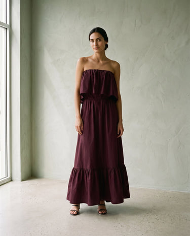 The Ivy Maxi in burgundy — strapless tiered maxi dress, front full-length view on model