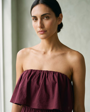 The Ivy Maxi in burgundy — close-up of ruffled strapless bodice and gathered neckline