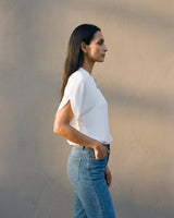 Side view of the white blouse worn with high-waist jeans – Moriel Heritage