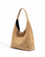 The Léa Slouch Tote in khaki suede, three-quarter studio view on a white background