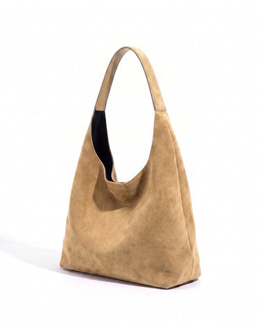 The Léa Slouch Tote in khaki suede, three-quarter studio view on a white background
