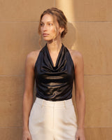 Model in the black cowl-neck halter top, angled front view – Moriel Heritage