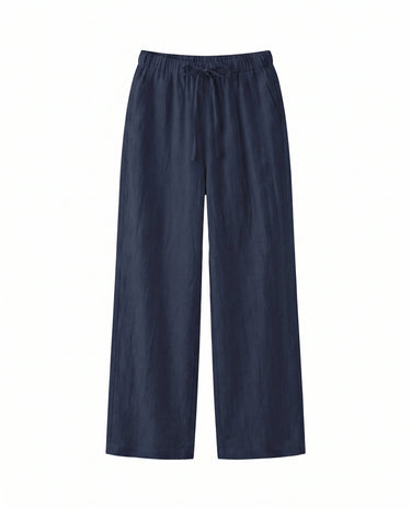 The Loelia Linen Pants in navy blue — high-waisted wide-leg drawstring linen trousers, product flat-lay