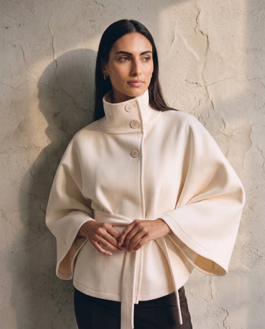 The Lorenne coat in white — front view on model