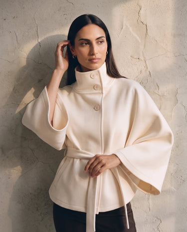The Lorenne coat in white — front view on model