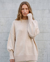 The Lorna knit pullover in beige — front view on model
