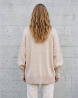 The Lorna knit pullover in beige — back view on model