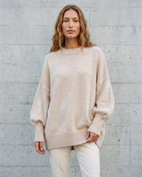 The Lorna knit pullover in beige — front view on model