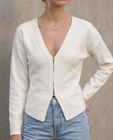 The Maisonette Cardigan in white — front view on model