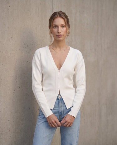 The Maisonette Cardigan in white — front view on model