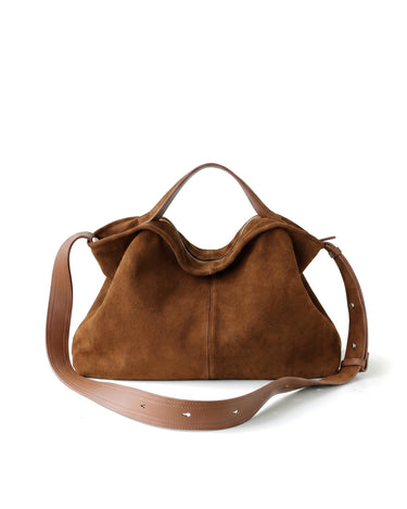 The Manon Suede Tote in tan, front view on a pure white studio background with leather top handle and shoulder strap