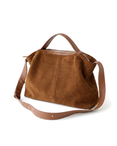 The Manon Suede Tote in tan, rear view showing the smooth leather base panel