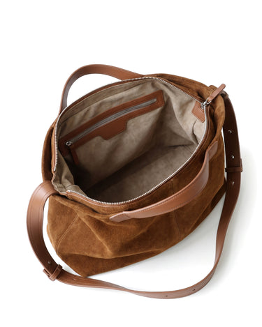 The Manon Suede Tote in tan, open top view showing the greige microsuede lining and leather-framed interior zip pocket