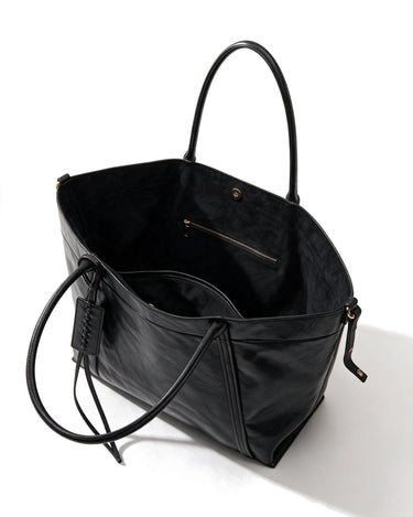The Marais Carryall in black, open top view showing the roomy interior and zip pocket