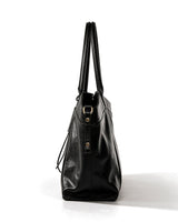 The Marais Carryall in black, side profile view showing the gusseted depth and buckle