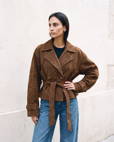 Model in the dark brown Margot Tie-waist Coat with hand on hip, front view showing the wide lapels