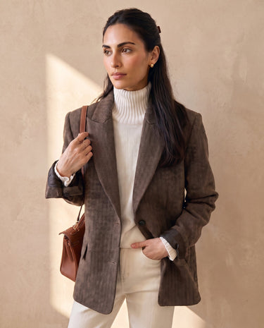 The Maribel blazer in brown — front three-quarter view on model