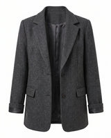 The Maribel blazer in dark gray — tailored wool-blend blazer with notch lapels and structured shoulders, product flat-lay