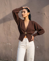 The Marley Cardigan in brown — front three-quarter view on model