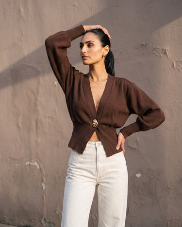The Marley Cardigan in brown — front three-quarter view on model