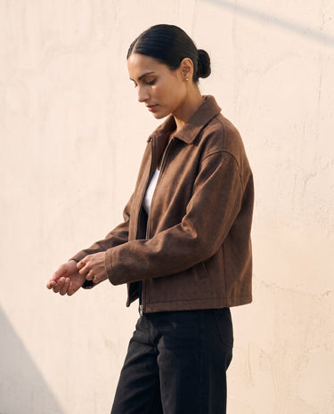 The Maude jacket in brown — side view on model