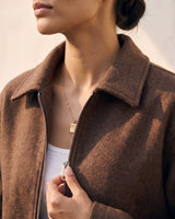 The Maude jacket in brown — close-up of the collar and zip
