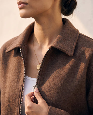 The Maude jacket in brown — close-up of the collar and zip