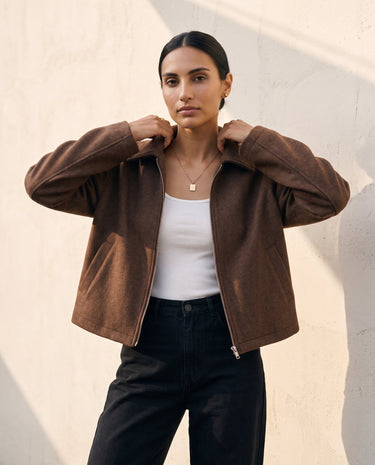 The Maude jacket in brown — front view on model