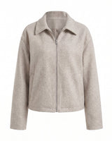 The Maude jacket in beige — zip-front collared jacket with a structured silhouette, product flat-lay
