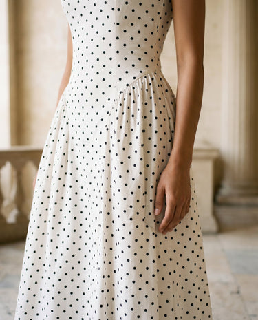 The Maura Polka Dot Dress in cream — close-up of the fitted bodice and A-line skirt