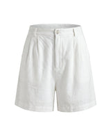 The Mauria Linen Shorts in white — high-waisted pleated linen shorts, product flat-lay