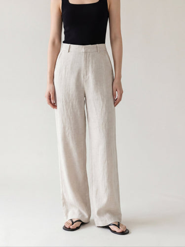 The Miela Linen Blend Pant in oat — high-waisted wide-leg linen-blend trousers, front view on model