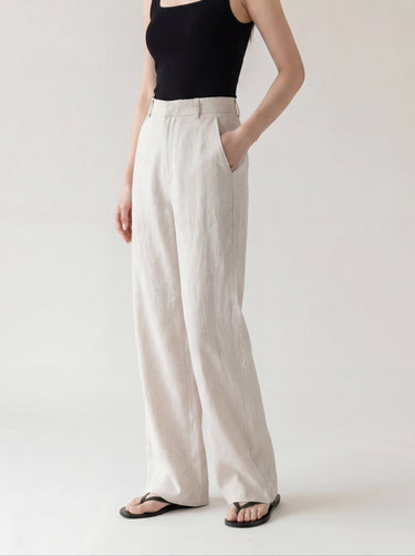 The Miela Linen Blend Pant in oat — wide-leg linen-blend trousers, three-quarter view on model