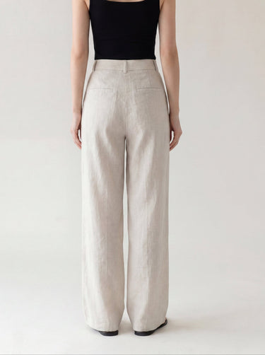 The Miela Linen Blend Pant in oat — wide-leg linen-blend trousers, back view on model