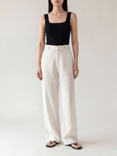 The Miela Linen Blend Pant in white — high-waisted wide-leg linen-blend trousers, front view on model