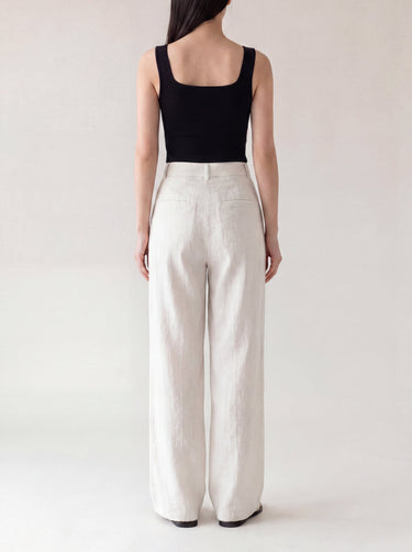 The Miela Linen Blend Pant in white — wide-leg linen-blend trousers, back view on model