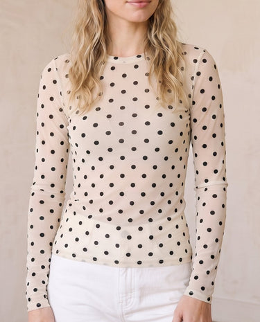 The Milly Polka Dot Sheer Top in cream — sheer polka dot mesh top, front view on model