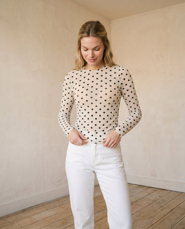 The Milly Polka Dot Sheer Top in cream — sheer polka dot mesh top, front styling view on model