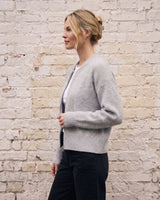 The Molly ribbed zip-up cardigan in gray — side view on model