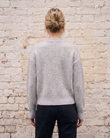 The Molly ribbed zip-up cardigan in gray — back view on model
