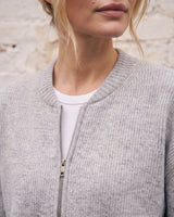 The Molly ribbed zip-up cardigan in gray — close-up of the round neck and front zip