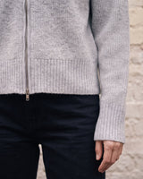 The Molly ribbed zip-up cardigan in gray — close-up of the ribbed hem and cuff
