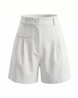 The Monroe short in white — high-waisted pleated wide-leg shorts, product flat-lay