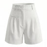 The Monroe short in white — high-waisted pleated wide-leg shorts, product flat-lay