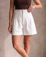 The Monroe short in white — side view on model