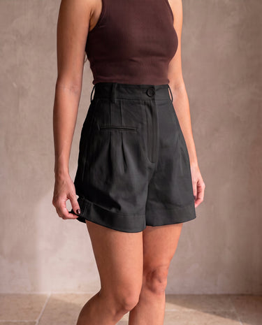 The Monroe short in black — front view on model